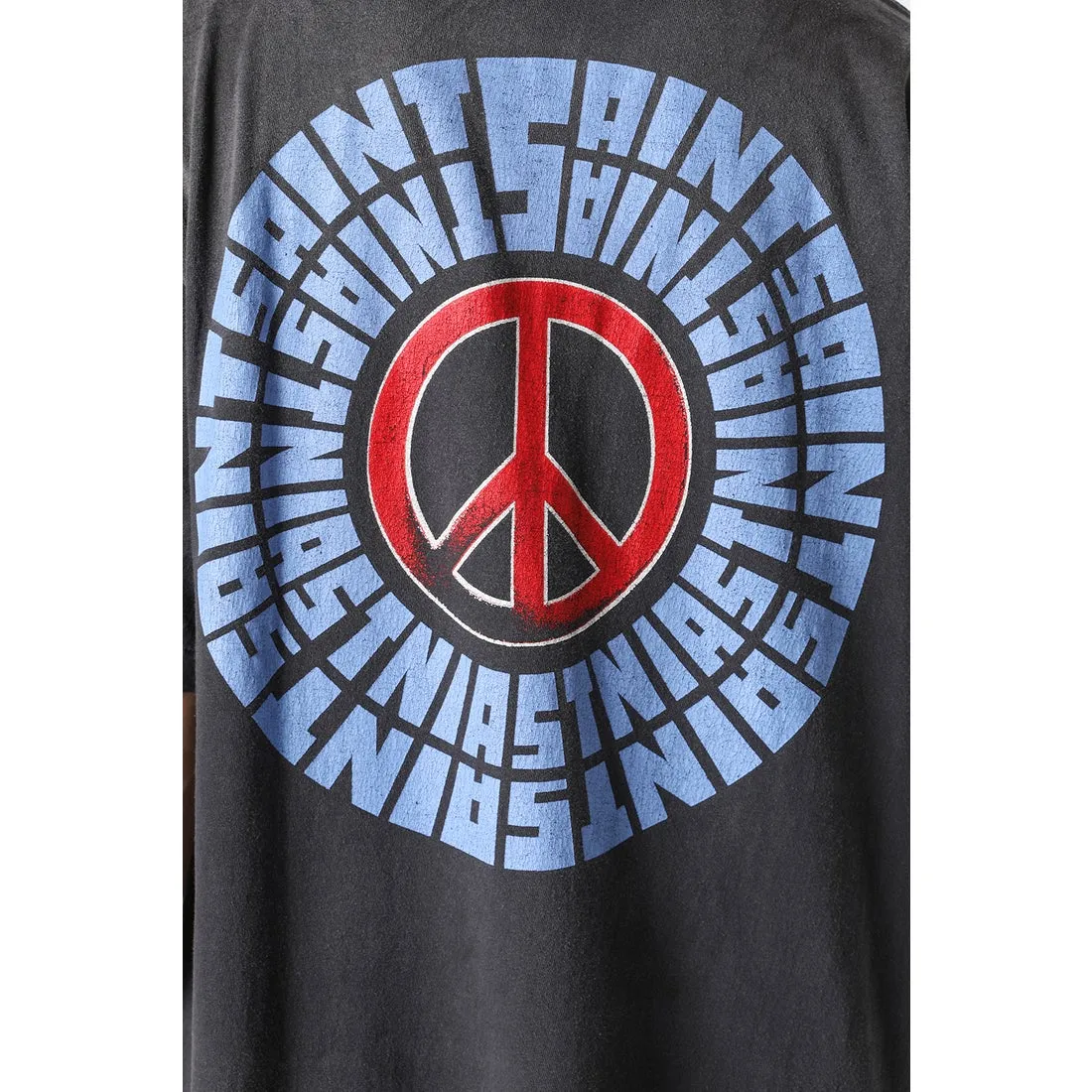 SAINT Mxxxxxx IDEOLOGICAL SS TEE/BLK Peace and anti-war crack pattern tee, washed black S-XL, look for the cylindrical fabric without side seams, the open width is almost meaningless Asut ready-made garments dyed, the whole piece is sprayed with horse-hair spray, and then sprayed again to fade, the collar and cuffs are frayed, many places are broken, oversized printing position, genuine level restoration, complete accessories, with little angel anti-counterfeiting label